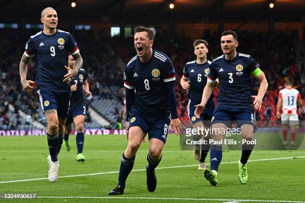 Callum McGregor of Scotland celebrates with teammates Lyndon Dykes and Andrew Robertson after scoring their side's first goal during the UEFA Euro...