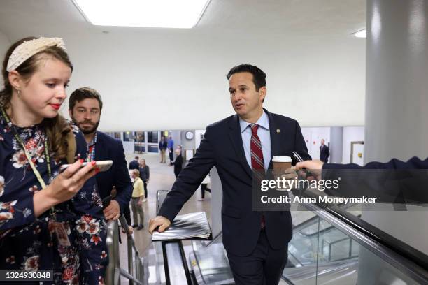 Sen. Brian Schatz speaks with reporters as he walks through the Senate Subway during a vote on June 22, 2021 in Washington, DC. The Senate will hold...