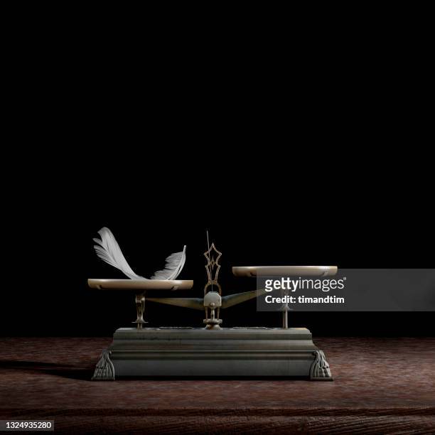 uneven old balance scale by a feather - uneven stock pictures, royalty-free photos & images