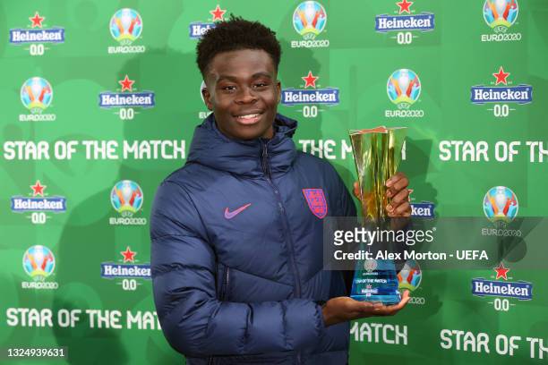 Bukayo Saka of England poses for a photograph with their Heineken "Star of the Match" award after the UEFA Euro 2020 Championship Group D match...