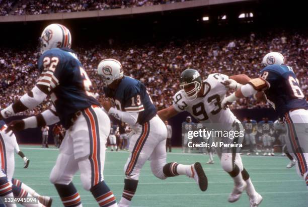 Defensive Lineman Marty Lyons of the New York Jets pressures Quarterback Dan Marino of the Miami Dolphins during the New York Jets vs Miami Dolphins...