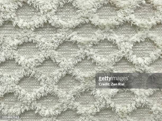 textures and patterns on a floor rug in off white color full frame - pollen stockfoto's en -beelden