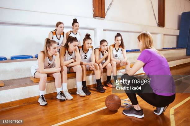 basketball girls team with female coach - basketball sport team stock pictures, royalty-free photos & images