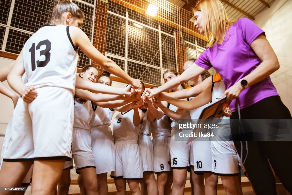 Basketball girls team with female coach
