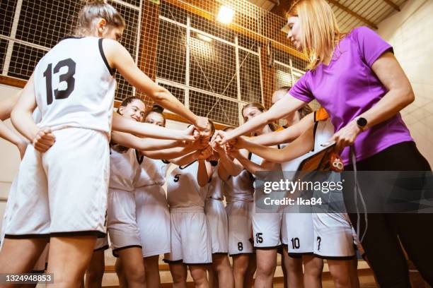 basketball girls team with female coach - womens basketball stock pictures, royalty-free photos & images