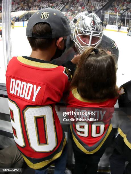 Robin Lehner of the Vegas Golden Knights visits his son Lennox Lehner and daughter Zoe Lehner during warmups before Game Five of the Stanley Cup...