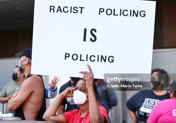 People protest outside the Unified School District headquarters calling on the board of education to 'fully defund' L.A. School police on June 22,...