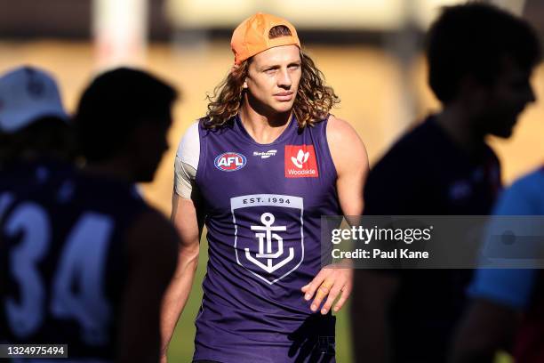 Nat Fyfe looks on during a Fremantle Dockers AFL training session at Victor George Kailis Oval on June 23, 2021 in Perth, Australia.