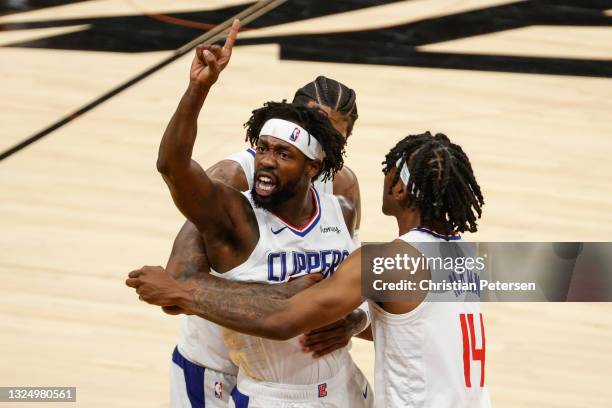 Patrick Beverley, Paul George, and Terance Mann of the LA Clippers react during the fourth quarter in game two of the NBA Western Conference finals...