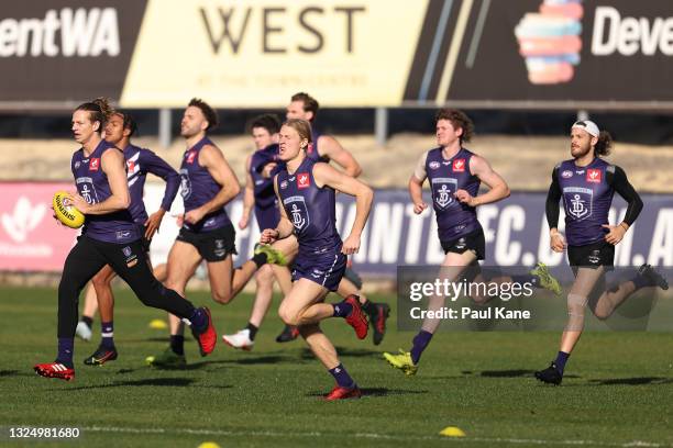 Nat Fyfe runs during a Fremantle Dockers AFL training session at Victor George Kailis Oval on June 23, 2021 in Perth, Australia.