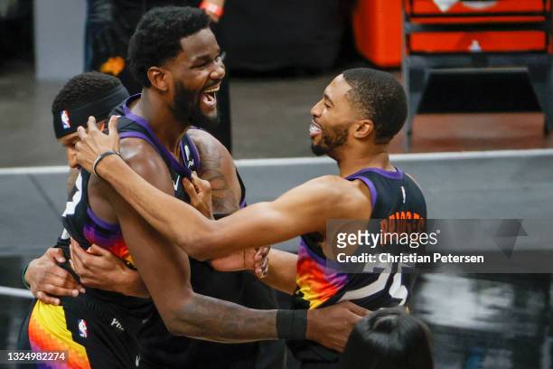 Deandre Ayton of the Phoenix Suns and Mikal Bridges celebrate defeating the LA Clippers 104-103 in game two of the NBA Western Conference finals at...