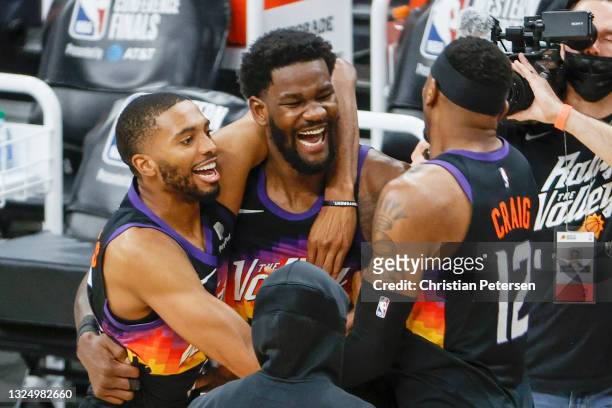 Deandre Ayton of the Phoenix Suns, Torrey Craig, and Mikal Bridges celebrate defeating the LA Clippers 104-103 in game two of the NBA Western...