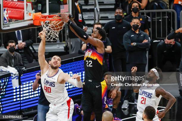 Deandre Ayton of the Phoenix Suns dunks the ball over Ivica Zubac of the LA Clippers during the fourth quarter in game two of the NBA Western...