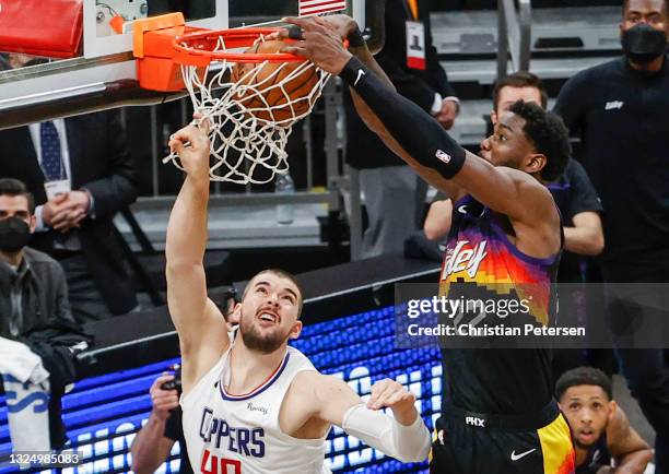 Deandre Ayton of the Phoenix Suns dunks the ball over Ivica Zubac of the LA Clippers during the fourth quarter in game two of the NBA Western...