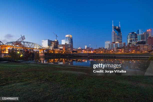 nashville at dusk with beautiful sky and water - nissan stadium nashville stock pictures, royalty-free photos & images