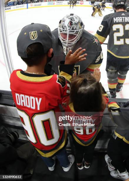 Robin Lehner of the Vegas Golden Knights visits his son Lennox Lehner and daughter Zoe Lehner during warmups before Game Five of the Stanley Cup...