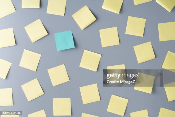 adhesive note standing out from the crowd - sticky stock pictures, royalty-free photos & images