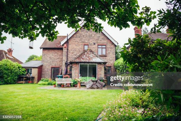 exterior of traditional english country house and garden - british culture garden stock pictures, royalty-free photos & images