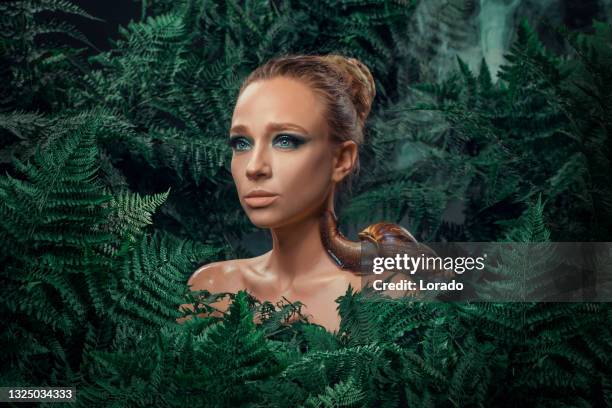 mother nature figure with snails - animal welfare stock pictures, royalty-free photos & images