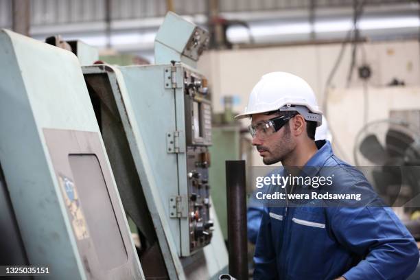 mechanical engineers maintenance working at factory - エンジンルーム ストックフォトと画像