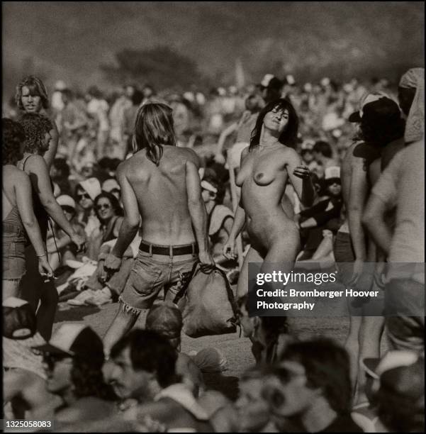 View of a shirtless man and a naked woman as they dance during the US Festival at Glen Helen Regional Park, San Bernardino, California, September 5,...