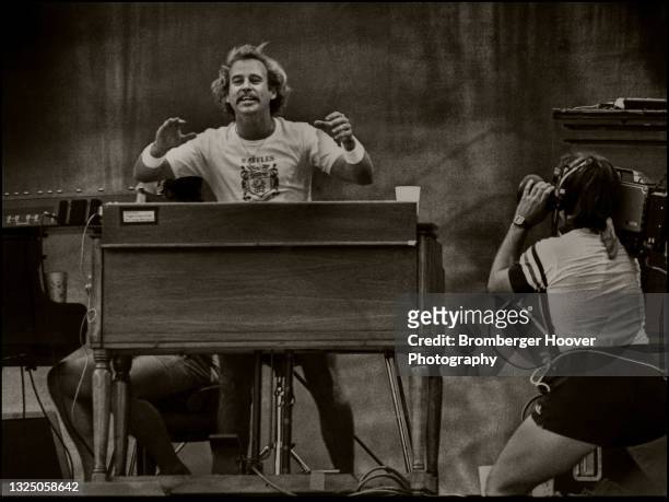 View of Pop musician Jimmy Buffett plays keyboards as he performs onstage at the US Festival at Glen Helen Regional Park, San Bernardino, California,...