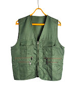 Isolated photo of green khaki hunting sleeveless jacket on hanger.