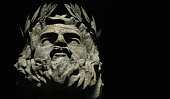 3d illustration of stone greek god Zeus face on black background.