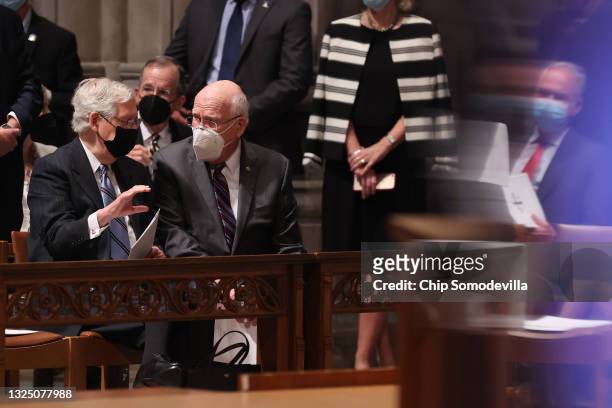 Senate Minority Leader Mitch McConnell and Sen. Patrick Leahy talk before the funeral service for former Sen. John Warner at the National Cathedral...