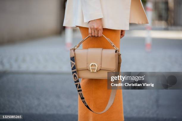 Aline Kaplan is seen wearing dress orange: Bec & Bridge, creme white Blazer : Ivy & Oak, beige bag Aigner, sandals Zara on June 23, 2021 in Berlin,...