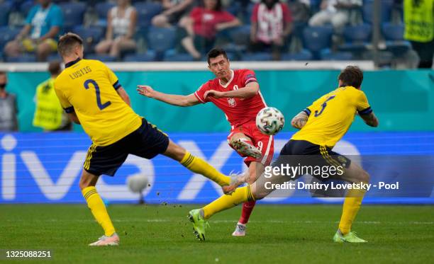 Robert Lewandowski of Poland scores their side's first goal during the UEFA Euro 2020 Championship Group E match between Sweden and Poland at Saint...