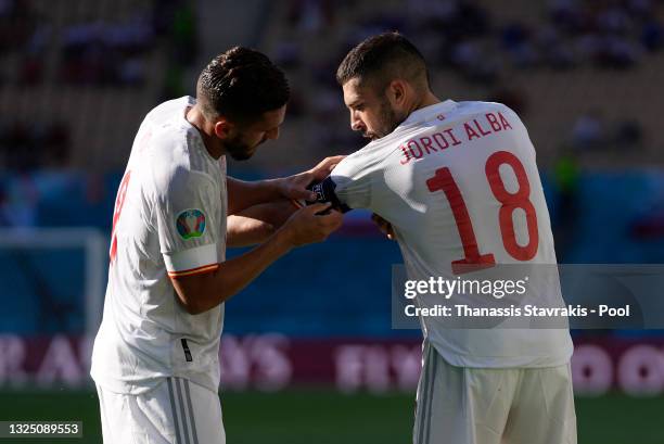 Jordi Alba of Spain has the captains arm band placed on his arm by team mate Koke during the UEFA Euro 2020 Championship Group E match between...