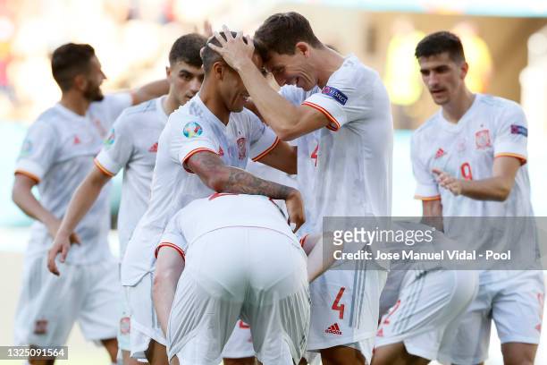 Thiago Alcantara and Pau Torres of Spain celebrate their side's fifth goal, an own goal by Juraj Kucka of Slovakia during the UEFA Euro 2020...