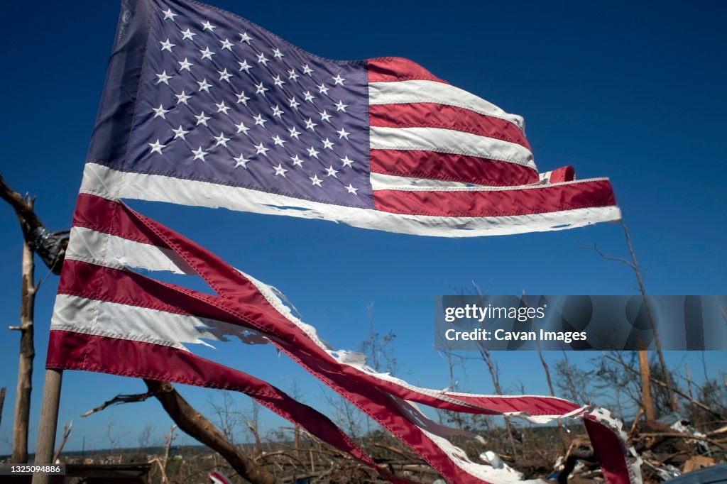 A tattered American flag flies over Alabama.