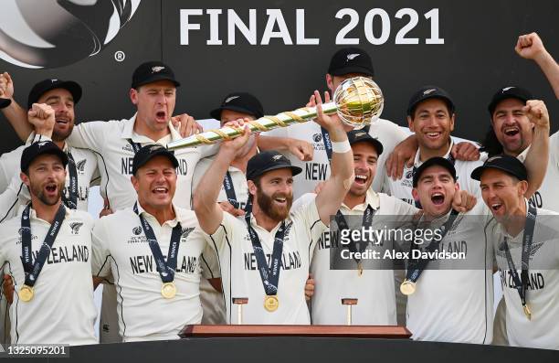 Kane Williamson of New Zealand lifts the ICC World Test Championship Mace with teammates after victory in the Reserve Day of the ICC World Test...
