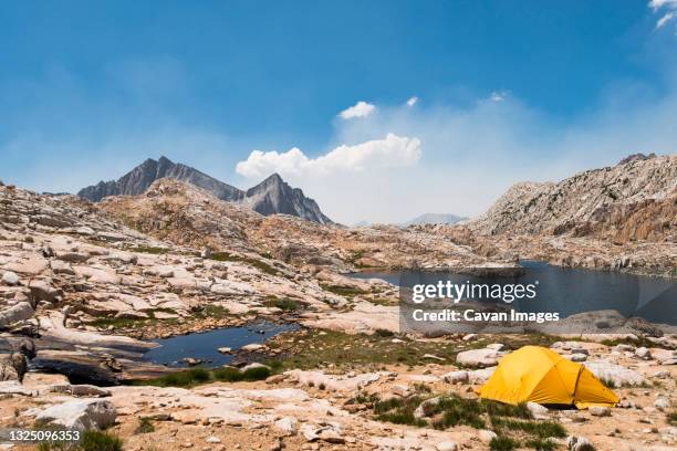 yellow tent beside big bear lake looking out over seven gables - big bear lake stock pictures, royalty-free photos & images