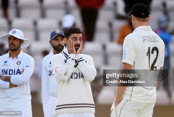 Virat Kohli of India talks to Kyle Jamieson after the Reserve Day of the ICC World Test Championship Final between India and New Zealand at The...