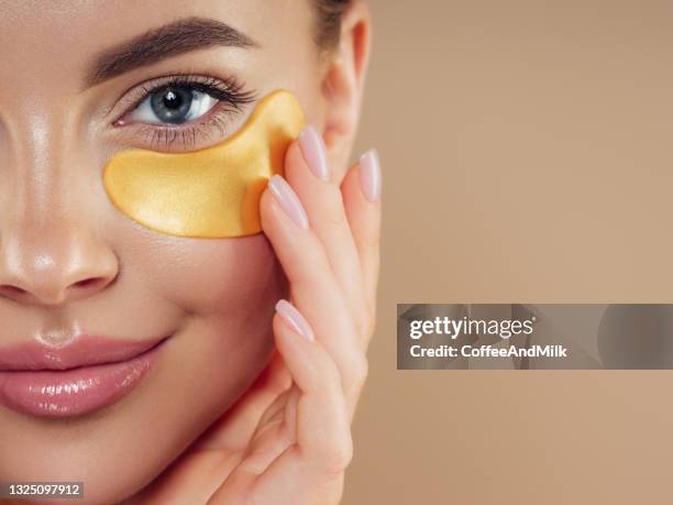 woman with eye patches under her eyes - eye patch stock pictures, royalty-free photos & images