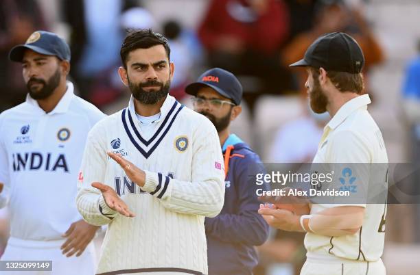 Virat Kohli of India speaks to Kane Williamson of New Zealand after the Reserve Day of the ICC World Test Championship Final between India and New...
