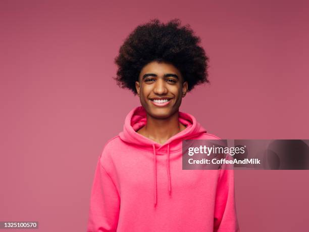 emotional african american man with african hairstyle wearing hoodie - man and his hoodie imagens e fotografias de stock