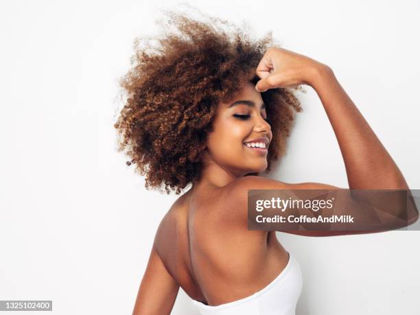 beautiful smiling girl with curly hairstyle - natural hair stock pictures, royalty-free photos & images