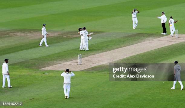 Kane Williamson and Ross Taylor of New Zealand celebrate victory after the Reserve Day of the ICC World Test Championship Final between India and New...