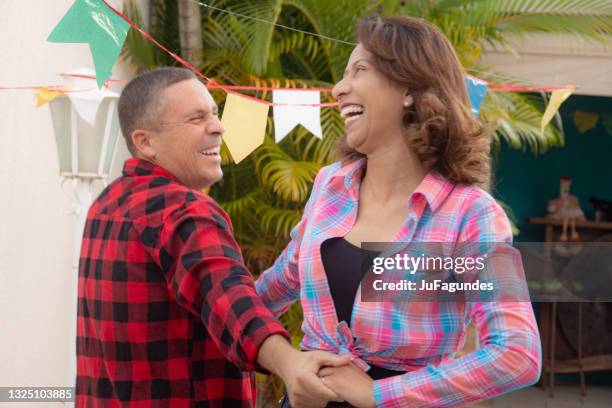 excited couple dancing square dance - square dancing stock pictures, royalty-free photos & images