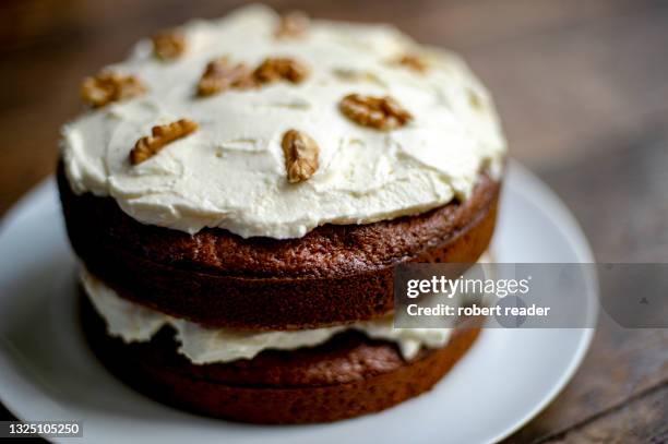 carrot and walnut cake - icing stock pictures, royalty-free photos & images