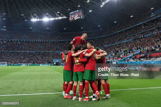 Cristiano Ronaldo of Portugal celebrates with teammates after scoring their side's first goal during the UEFA Euro 2020 Championship Group F match...