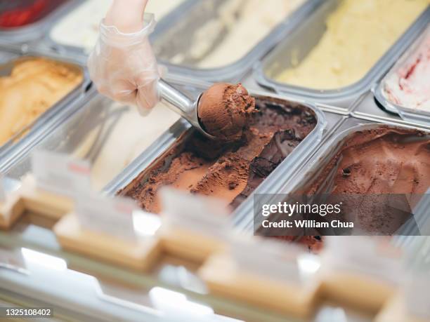 close up of scooping ice cream in gelato cafe - ice cream shop stock pictures, royalty-free photos & images