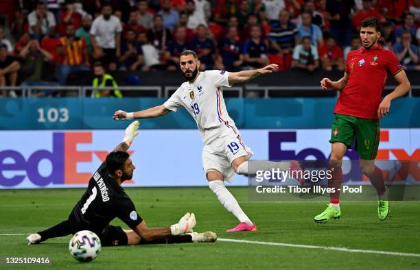 Karim Benzema of France scores their side's second goal past Rui Patricio of Portugal during the UEFA Euro 2020 Championship Group F match between...