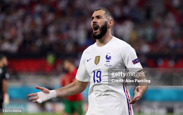 Karim Benzema of France reacts after the linesman gives his goal as on offside. After a VAR check the goal stands and France score their second goal...