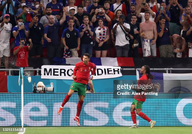 Cristiano Ronaldo of Portugal celebrates with teammate Renato Sanches after scoring their side's second goal from the penalty spot during the UEFA...