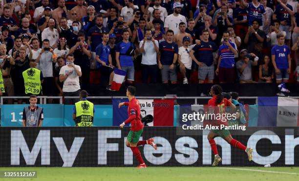 Cristiano Ronaldo of Portugal celebrates with teammate Renato Sanches after scoring their side's second goal from the penalty spot during the UEFA...